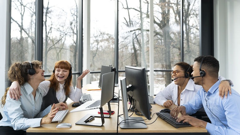 Customer service team providing multichannel support in office