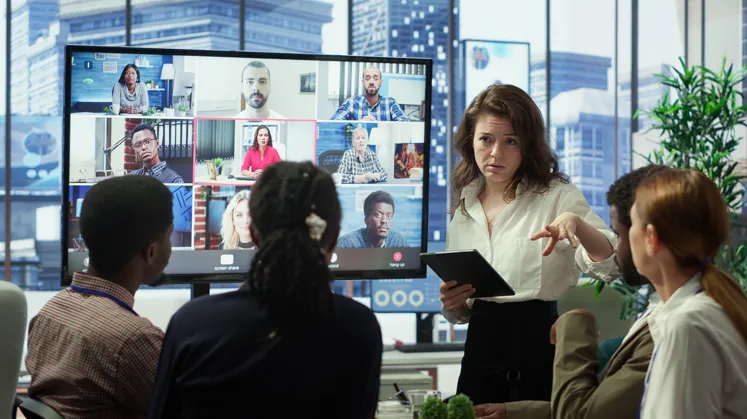 Hybrid team collaborating through video conference meeting