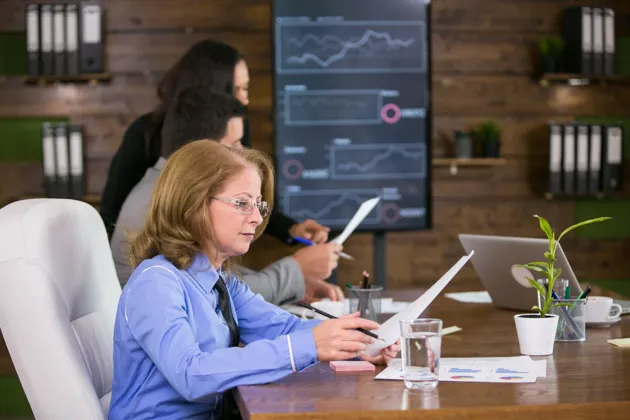 Office team analyzing reports