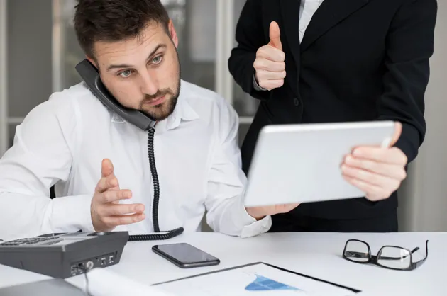 Business professionals discussing office work