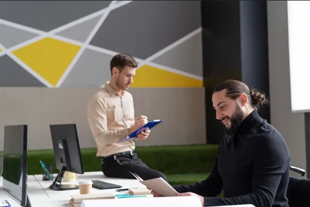 Office professionals reviewing business documents