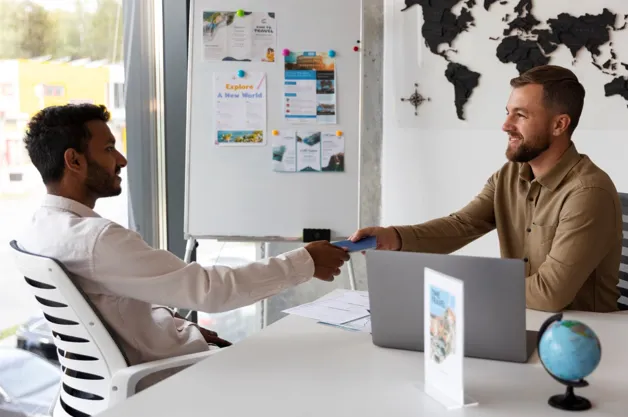 Travel agent assisting customer with booking