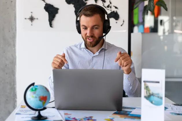 Travel consultant assisting customers through online consultation